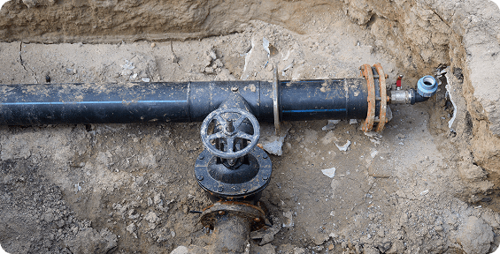 Underground pipe with a metal valve.