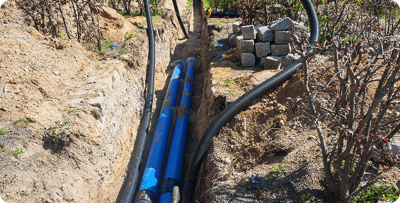 Underground pipes in a trench under construction.